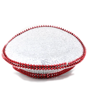 Detailed view of silver sequin captain hat with bold red metallic spiked stud trim