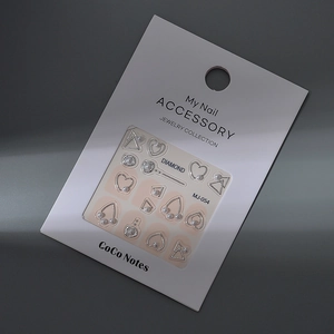 Set of silver heart and pearl nail art accessories on MJ-054 display card