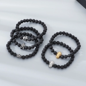 8mm black lava stone bead bracelet set with silver and gold Buddha and Spartan helmet charms