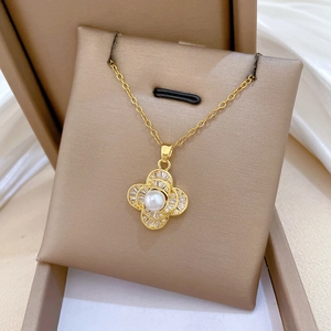 Luxurious gold stainless steel pearl pendant necklace with sparkling crystal details