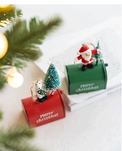 Close-up of Christmas iron mailbox ornaments with Santa and polar bear figurines