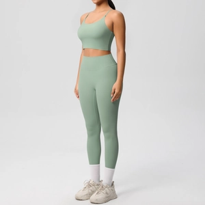 Detail view of the seamless stitching and sage green matte fabric on yoga set