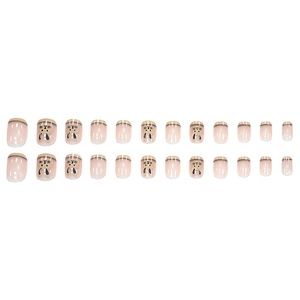 Short nude press-on nails with black French tips and cute minimalist rabbit designs