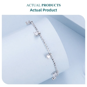 Macro shot of s925 silver beaded bracelet featuring square-cut sparkling zirconia gems