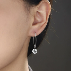 Elegant 925 sterling silver hoop earrings featuring a brilliant round moissanite stone