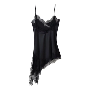 Detail of black satin slip dress showing V-neck lace trim and delicate spaghetti straps