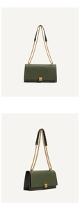 Close-up of dark green quilted shoulder bag with gold chain and metal lock details
