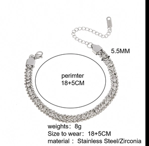 Detailed view of silver stainless steel cuban link bracelet with zircon and Sister tag