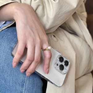 Close-up of elegant 925 sterling silver gold ring with a round white pearl on hand