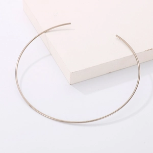 Detail of minimalist gold-tone stainless steel open neck collar for DIY jewelry projects