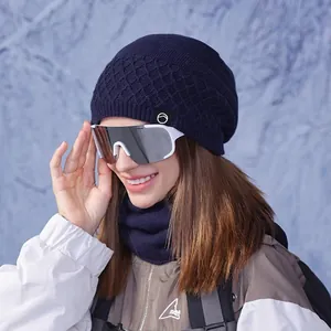 Winter knitted hat and neck gaiter set in dark blue with professional ski goggles