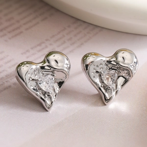 Minimalist silver heart stud earrings with liquid metal texture and clear zircon stones