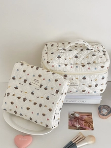 Quilted white cosmetic bags with cute puppy prints and portable top handle design