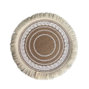 Bohemian round woven placemat with jute texture, white lace floral pattern and fringe edge
