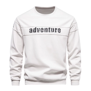 Close-up of ribbed cuffs and adventure print on white long-sleeved sweatshirt