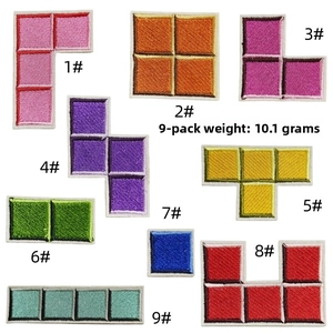 Detailed close-up of nine colorful tetris shaped embroidery patches for DIY clothing