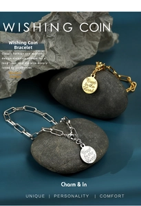 Detailed macro view of the gold and silver coin bracelets with Trust in the Lord engraving