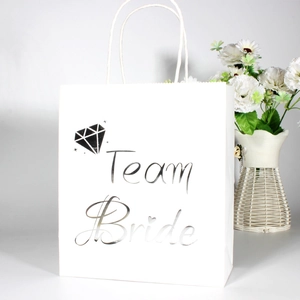 White wedding paper gift bag with silver Team Bride text and diamond pattern