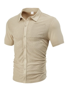 Detail shot of khaki men's shirt showing the woven texture, collar label, and M size tag