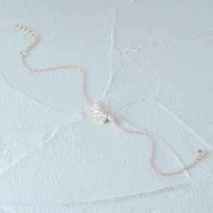 Detail of silver S925 bracelet featuring marquise-cut cubic zirconia and extension chain