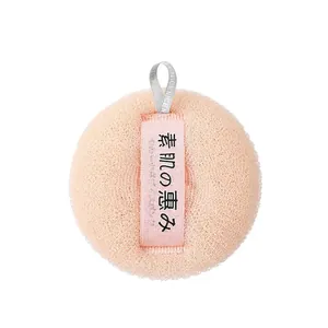 Soft pink Japanese bath sponge for painless exfoliating and rich foaming massage