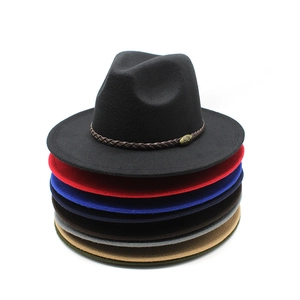 Vertical stack of colorful wool felt fedora hats featuring a leather band with metal buckle