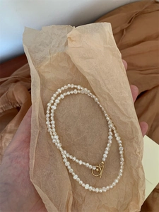 Baroque freshwater pearl necklace with gold OT clasp on vintage paper packaging