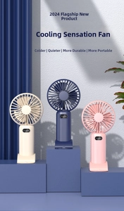 Detail view of portable handheld fans in three colors on modern blue display stands