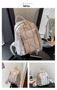 Detailed view of white mini backpack featuring grey LUCKY letter print and gold zippers