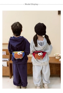 Detailed view of kids cartoon car fanny packs in red and blue color block nylon