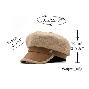 Detailed size measurement chart for beige and brown leather newsboy cap with M logo