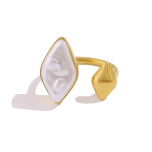 Detail of gold open ring featuring asymmetrical rhombic pearls and polished metal finish