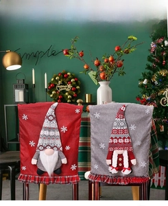 Detailed close-up of Christmas gnome chair covers with 3D embroidery and ruffled check hem
