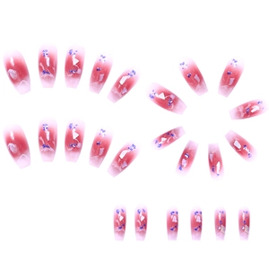 Pink gradient long coffin press-on nails with blue accents and marble patterns