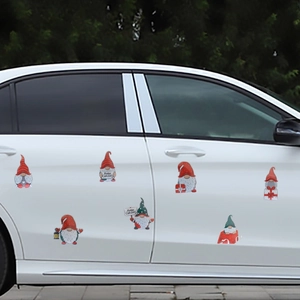 Christmas gnome magnet car stickers with Merry Christmas text on a white vehicle door
