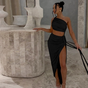Detail of black one-shoulder cutout dress with side slit and ruched texture fabric