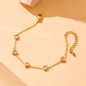 Golden stainless steel chain bracelet featuring five sparkling heart-shaped zircon stones