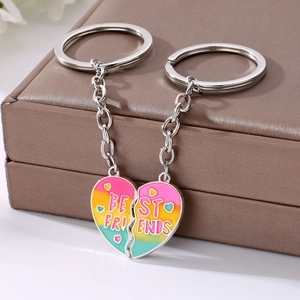 Detail of magnetic heart puzzle keychain with rainbow enamel and Best Friends text