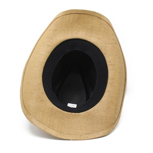 Detail view of woven paper straw cowboy hat interior with sweatband and care label
