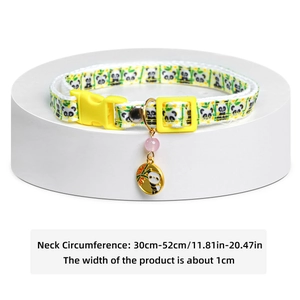 Detail of yellow pet collar with panda patterns, adjustable buckle and metal charm