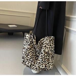 Close-up of lightweight leopard print quilted tote bag with spacious interior design