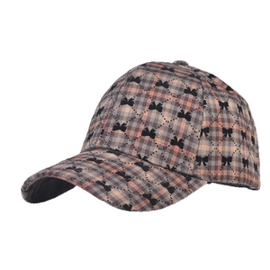 Classic plaid baseball cap with black bow print in brown and orange autumn color palette