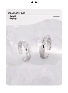 Detail of S925 sterling silver rings featuring brushed rock texture and inlaid zircons