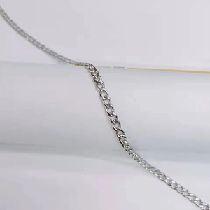 Close-up detail of silver stainless steel cuban link chain with high polish finish