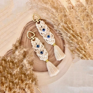 Handmade Bohemian tassel keychain set with blue evil eye beads and golden heart clasp