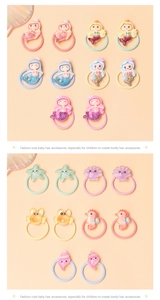 Detail of colorful resin ocean animal charms on soft elastic hair ties for kids