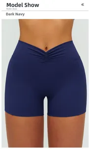 Detail of high waisted yoga shorts in deep navy blue with V-shape waistband and scrunch butt