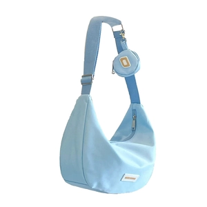 Light blue nylon crescent bag with wide adjustable strap and matching small round coin purse