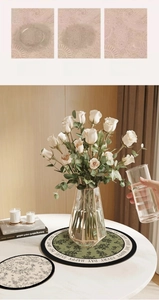 Close-up of floral absorbent coaster with Happy Every Day text on marble table