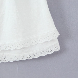 White lace trim camisole dress featuring elegant layered embroidery and cotton texture